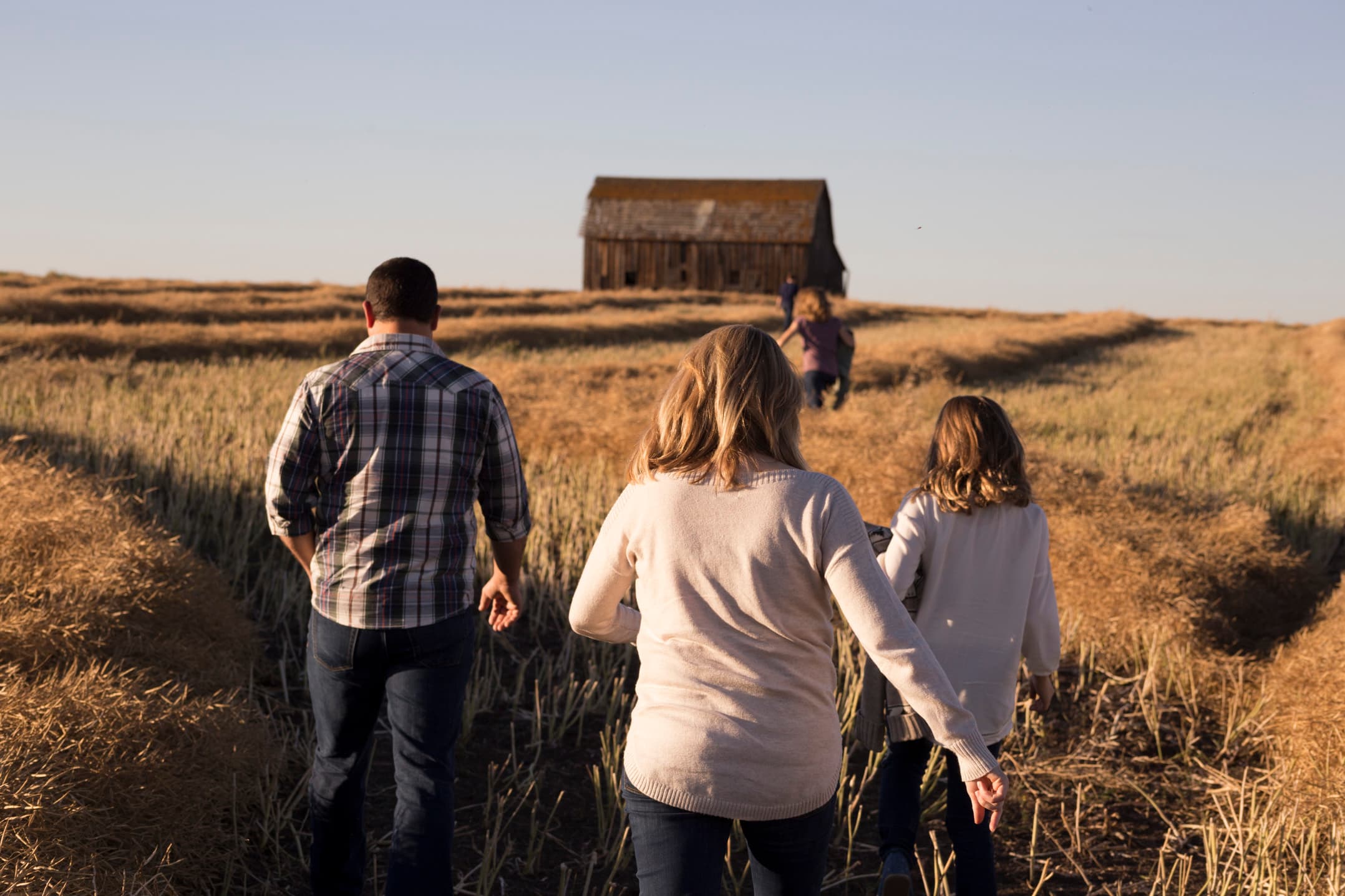 Farm and Farming workers stroll back to the shed